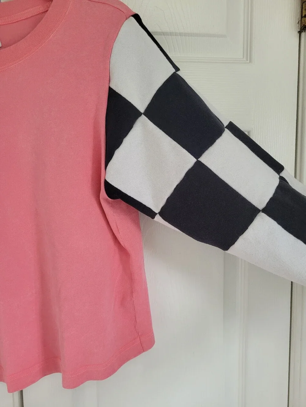 Nike Pink Sweatshirt with Black & White Checkerboard Sleeves